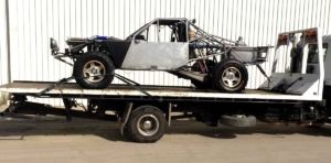 Central Hills Auto Wreckers Towing truck with car on the tray