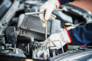 Mechanic servicing car